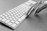 Futuristic silver gray hand and keyboard