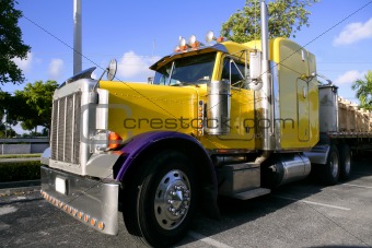 yellow american truck with stainelss steel