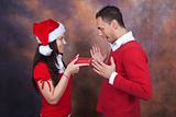 happy young couple with christmas clothes