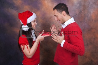 happy young couple with christmas clothes
