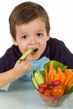 Healthy little boy with a bowl of vegetables