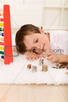 Little boy counting his money