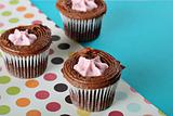 shot of polka dot raspberry filled cupcakes