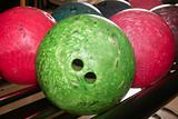 Bowling balls red green closeup row