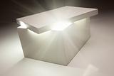 White Box with Lid Revealing Something Very Bright on a Grey Background.