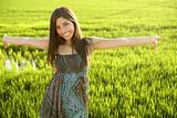 Beautiful brunette indian woman in green rice fields