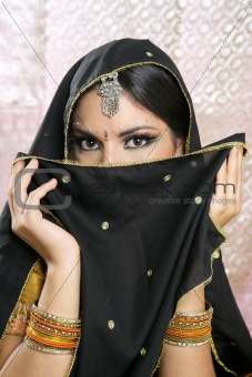 Beautiful brunette asian girl with black veil on face