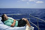 Sailor senior man having a rest on summer boat