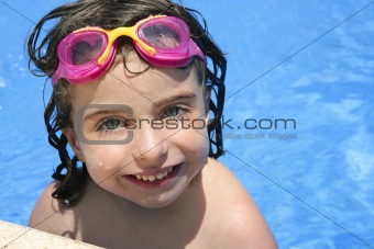 beautiful little girl smiling in   pool