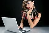 Attractive brunette fashion woman with laptop