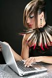 Attractive brunette fashion woman with laptop