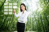 Brunette ecological businesswoman touch keypad