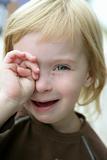 Adorable blond little girl crying portrait