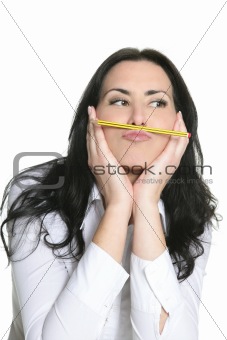 Brunette woman thinking with pencil