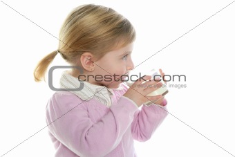 blond little girl drinking glass of milk