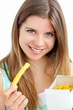 Pretty young woman eating chips