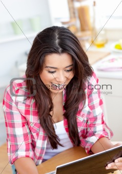 Caucasian young woman is using a laptop 