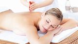 Attractive woman having a massage with massage oil 