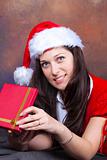 young girl in red with christmas clothes and gift box