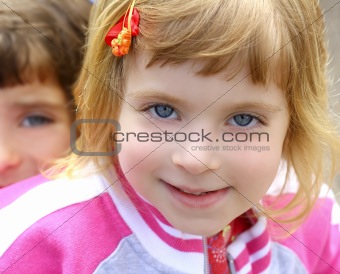 blond little girl portrait funny gesturing face