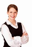 Business woman with crossed arms looks laughs happy into camera