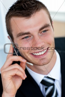 Pretty businessman using his mobile phone