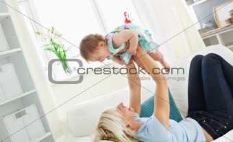 Merry mother playing with her daughter