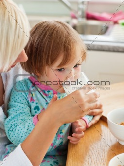 Beauty mother and daughter having breakfast