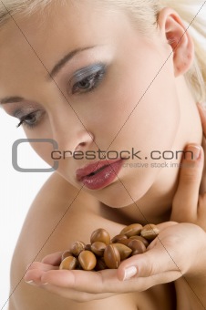 beauty girl with argan seed