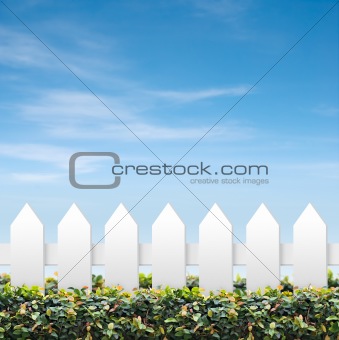 Sky and white fences