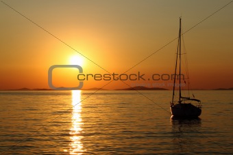 Gold romantic sunset with yacht