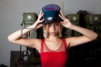 young woman with a welder mask