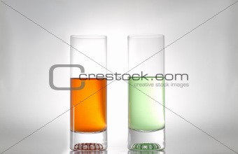 two glasses with liquids