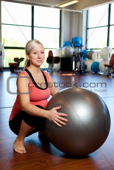 Pregnant women doing squatting exercise.