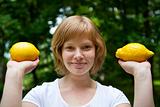 Girl holding lemons