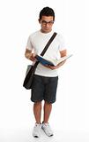 Standing student reading book studying