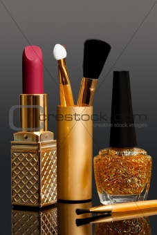 lipstick; enamel and cosmetic brushes
