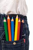 Colored pencils in kids jeans pocket