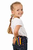 Little girl with lots of pencils in her pocket