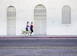 Women jogging with pet dog