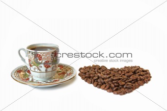 Cup of coffee and heart shaped coffee beans