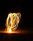 Fire dancer at night