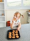Cute girl eating cookie