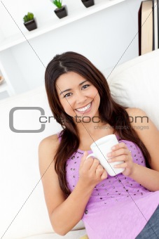 Charming woman holding a cup