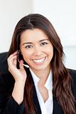 Confident asian businesswoman wearing headphones 