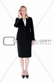 Confident young businesswoman talking on phone 