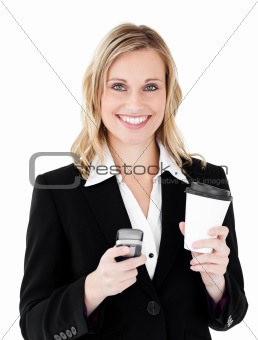 Beautiful  businesswoman holding coffee and using her cellphone