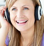 Laughing woman listening to music