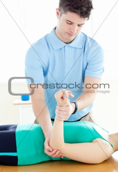 Handsome man doing fitness exercises with a woman