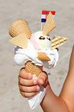 Creative Ice Cream in hand with flag of Croatia